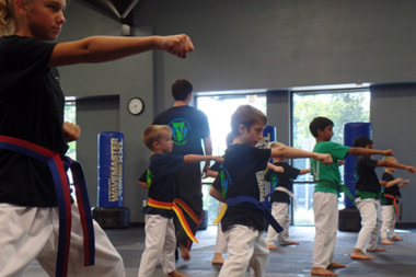 kids punching in karate class